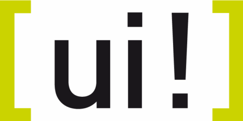 Das Bild zeigt die Kleinbuchstaben "ui" gefolgt von einem Ausrufezeichen in fetter schwarzer Schrift, zentriert auf einem weißen Hintergrund mit gelben Klammern an den Seiten.