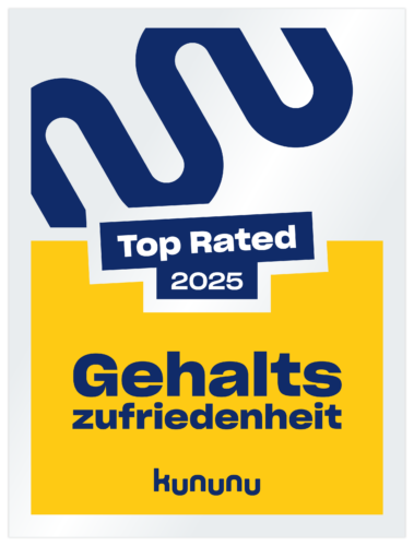 Ein Abzeichen mit der Aufschrift "Top Rated 2025 Gehaltszufriedenheit kununu" in fetten Buchstaben, mit blauen und gelben Farben und einem stilisierten "W" an der Spitze.
